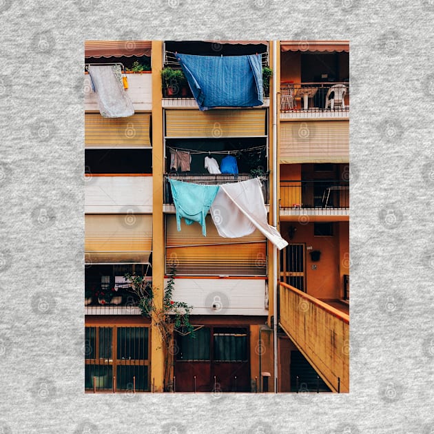 Vintage Building Facade with Drying Laudry on Balcony in Italy by visualspectrum